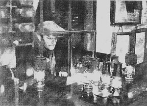 The Overman preparing the safety lamps for the miners